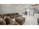 Spacious game room with sectional sofa and marble floors at 2393 Appy Ln, Apopka, FL 32712
