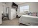 Bright bedroom with a full-size bed, large window, and plenty of storage at 2393 Appy Ln, Apopka, FL 32712