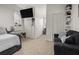 Spacious bedroom with a daybed, built-in shelving, and a large window at 2393 Appy Ln, Apopka, FL 32712