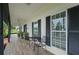 Charming front porch with black shutters and tile flooring at 2393 Appy Ln, Apopka, FL 32712