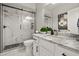 Modern bathroom with a large walk-in shower, marble countertops, and a white vanity at 2393 Appy Ln, Apopka, FL 32712