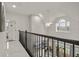 Upstairs hallway with marble floors and access to multiple rooms at 2393 Appy Ln, Apopka, FL 32712