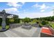 Relaxing fire pit area with built-in seating at 2393 Appy Ln, Apopka, FL 32712