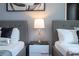 Two twin beds with a nightstand between them at 7514 Sunflower Cir, Kissimmee, FL 34747