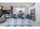 Modern kitchen with stainless steel appliances and breakfast bar at 7514 Sunflower Cir, Kissimmee, FL 34747