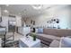 Bright and airy living room with sectional sofa and open concept design at 7514 Sunflower Cir, Kissimmee, FL 34747