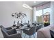 Modern dining area with glass-top table and gray chairs at 7514 Sunflower Cir, Kissimmee, FL 34747