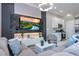 Open living area with sectional sofa and large TV at 7514 Sunflower Cir, Kissimmee, FL 34747