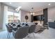 Elegant dining room with glass table and gray chairs at 7514 Sunflower Cir, Kissimmee, FL 34747