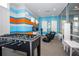 Fun game room with foosball, video games, and seating at 7514 Sunflower Cir, Kissimmee, FL 34747