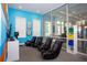 Bright game room with gaming chairs and large TV at 7514 Sunflower Cir, Kissimmee, FL 34747