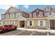 Inviting exterior of a two-story townhouse with landscaping at 7514 Sunflower Cir, Kissimmee, FL 34747