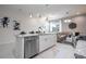 Modern kitchen featuring white cabinets and granite countertops at 7514 Sunflower Cir, Kissimmee, FL 34747