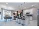 Open concept kitchen with island and stainless steel appliances at 7514 Sunflower Cir, Kissimmee, FL 34747