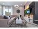 Spacious living room with sectional sofa and large TV at 7514 Sunflower Cir, Kissimmee, FL 34747