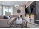 Spacious living room with sectional sofa and large TV at 7514 Sunflower Cir, Kissimmee, FL 34747