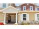 Townhouse exterior with two-toned siding and columns at 7514 Sunflower Cir, Kissimmee, FL 34747