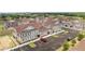 Aerial view of a community with townhouses and ample parking at 7514 Sunflower Cir, Kissimmee, FL 34747
