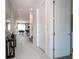 Bright hallway with wood-look floors, leading to living areas at 7514 Sunflower Cir, Kissimmee, FL 34747