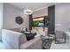 Spacious living room with modern sectional sofa and large TV at 7514 Sunflower Cir, Kissimmee, FL 34747