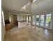 Open concept kitchen with views of the Gathering room and pool at 7706 Excitement Dr, Reunion, FL 34747