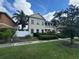 Two-story house with landscaping at 7706 Excitement Dr, Reunion, FL 34747