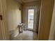 Powder room with pedestal sink and access to backyard at 7706 Excitement Dr, Reunion, FL 34747