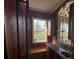 Wet bar with granite countertop, wine rack, and wrought iron accents at 7706 Excitement Dr, Reunion, FL 34747