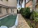 Private backyard with a swimming pool and brick pavers at 7706 Excitement Dr, Reunion, FL 34747