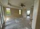 Large bedroom with ceiling fan and access to en-suite bathroom at 7706 Excitement Dr, Reunion, FL 34747