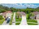 Single-Gathering house with driveway and landscaping at 1033 Hacienda Cir, Kissimmee, FL 34741