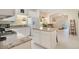 Modern kitchen with granite countertops and white cabinets at 1033 Hacienda Cir, Kissimmee, FL 34741