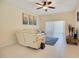Living room boasts a sectional sofa, ceiling fan, and wood accent table at 1033 Hacienda Cir, Kissimmee, FL 34741