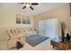 Living room with sectional sofa, tile floors, and sliding glass doors at 1033 Hacienda Cir, Kissimmee, FL 34741