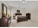 Main bedroom with dark wood furniture and carpeted floors at 1033 Hacienda Cir, Kissimmee, FL 34741