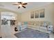 Spacious living room featuring a large sectional sofa and tile floors at 1033 Hacienda Cir, Kissimmee, FL 34741