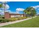 Estancia community entrance with brick signage and landscaping at 1033 Hacienda Cir, Kissimmee, FL 34741