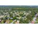 Aerial view of a residential neighborhood with lush green trees and houses at 888 Chokecherry Dr, Winter Springs, FL 32708