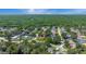 Wide aerial view of a residential neighborhood with houses and green space at 888 Chokecherry Dr, Winter Springs, FL 32708