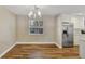 Bright dining area with wood-look floors and large window at 888 Chokecherry Dr, Winter Springs, FL 32708