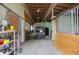 View of a barn interior with storage and a vehicle at 2393 Appy Ln, Apopka, FL 32712