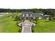 Large house with circular driveway and landscaping at 2393 Appy Ln, Apopka, FL 32712
