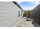 Neat side yard with gravel pathway and grill at 2393 Appy Ln, Apopka, FL 32712