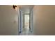 Bright hallway with tile floors and access to bedrooms at 408 S Alder Ave, Orlando, FL 32807