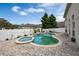 Freeform swimming pool and spa with brick patio and privacy fence at 12986 Maribou Cir, Orlando, FL 32828