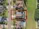 Aerial view of home with pool and solar panels, located in a quiet residential area at 1106 Kerwood Cir, Oviedo, FL 32765