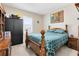 Bedroom with wooden furniture and teal bedding at 13168 Lower Harden Ave, Orlando, FL 32827