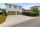 Two-car garage with green doors and a paved driveway at 13168 Lower Harden Ave, Orlando, FL 32827