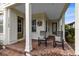 Front porch with rocking chairs and brick floor at 13168 Lower Harden Ave, Orlando, FL 32827