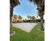 Community volleyball court with surrounding palm trees at 1944 Conway Rd # 6, Orlando, FL 32812